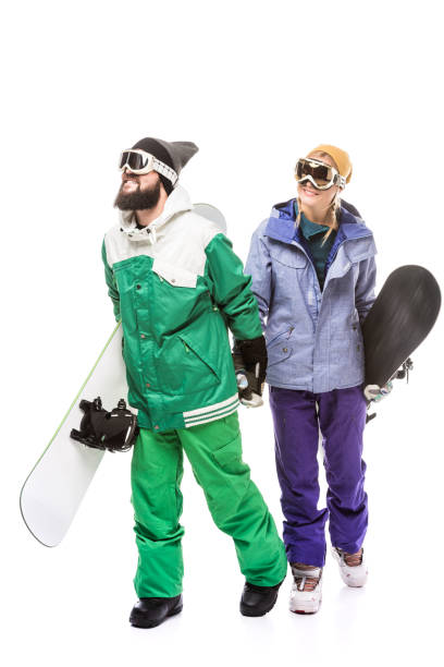 istock couple in snowboarding costumes with snowboards 903666854