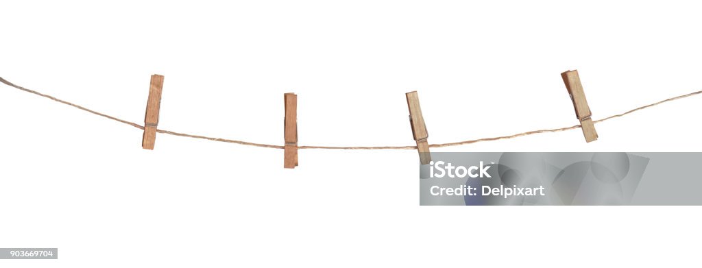 Four wooden clothespins on a rope, isolated on white background Clothesline Stock Photo