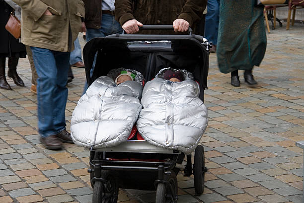 babies in stroller on a winter day stock photo