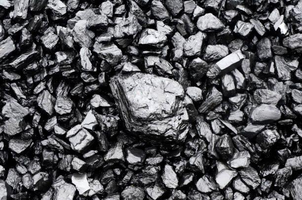 Pile of black coal Close up view of black coal as background lead stock pictures, royalty-free photos & images