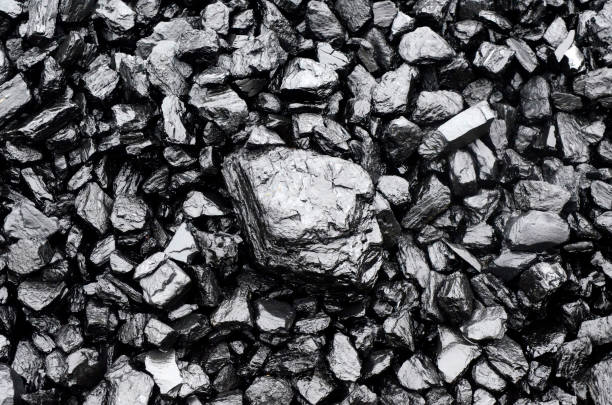 Pile of black coal Close up view of black coal as background lead mine stock pictures, royalty-free photos & images