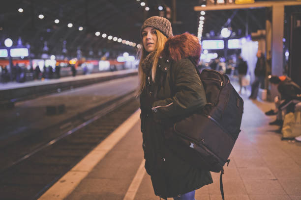 Young tourist with a backpack on the railroad station in Cologne
