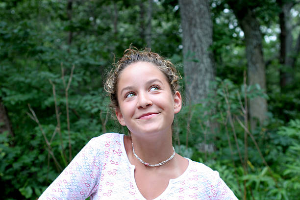 istock Pretty girl smiling looking up 90367996