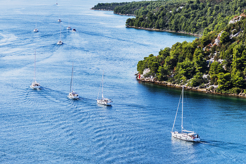 Yachting sail boats near the croatian islands. Travel, sport and active lifestyle concept