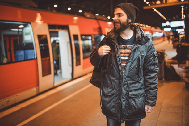 istock Man with a backpack on the railroad station in Germany 903683036