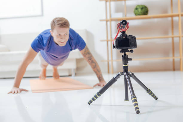 istock Young trainer being in the process of recording a video lesson 903686412