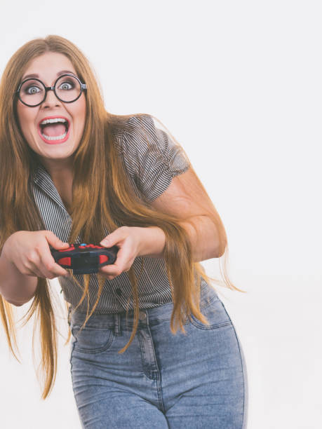 istock Gamer woman holding gaming pad 903695894