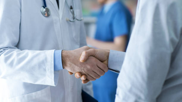 istock Doctor and patient shaking hands 903696666