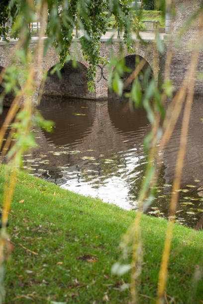 Old fortified bridge of Elburg with old architecture elements. Water scene in holland
