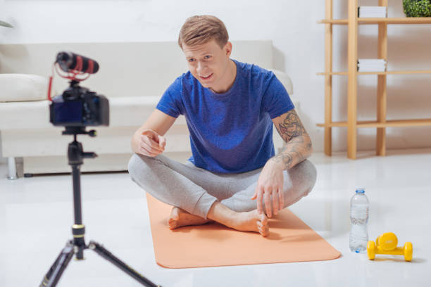 istock Smart blogger pointing to the camera while addressing his viewers 903699444
