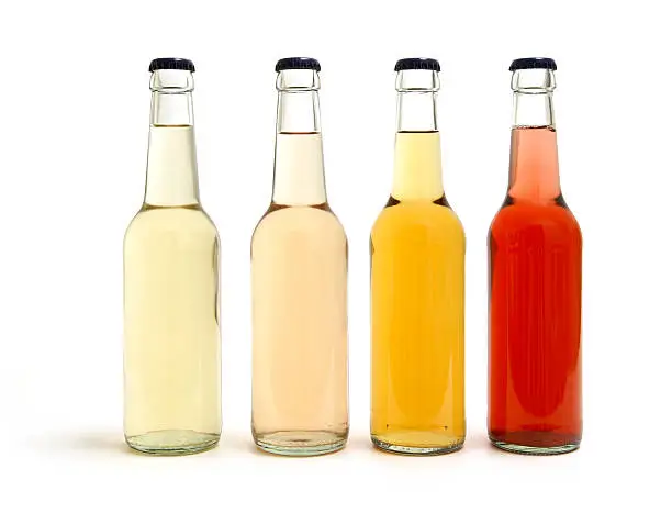 four soda pop / lemonade bottles     isolated on white background              