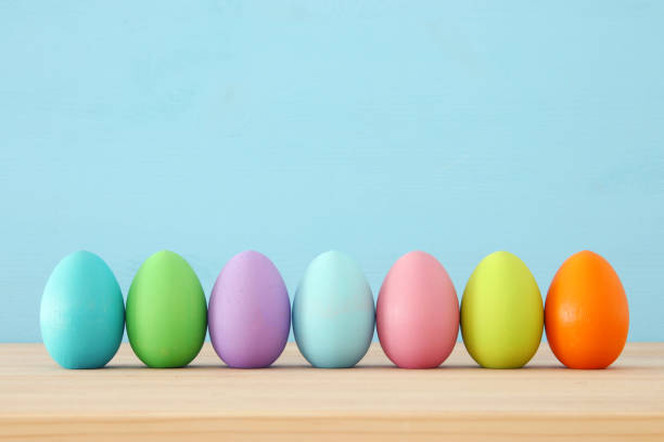 istock Top view of easter colorful eggs over blue background 903702020