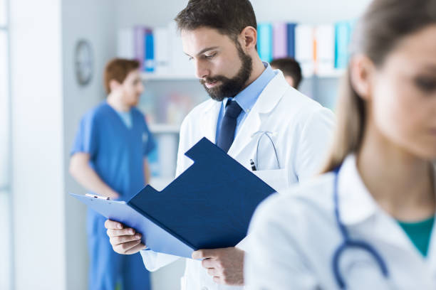 istock Doctor checking medical records 903702060