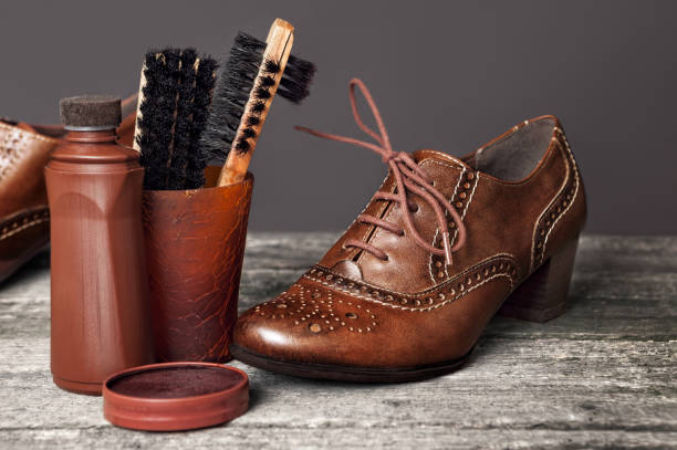 istock Brown shoes with brush and polish cream 903702930