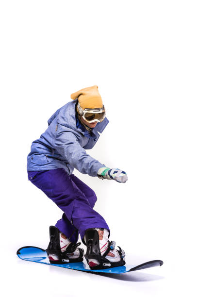 istock woman sliding on snowboard 903703990