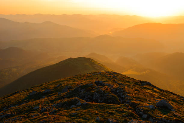istock Mountains and hills at beautiful orange sunset 903707542