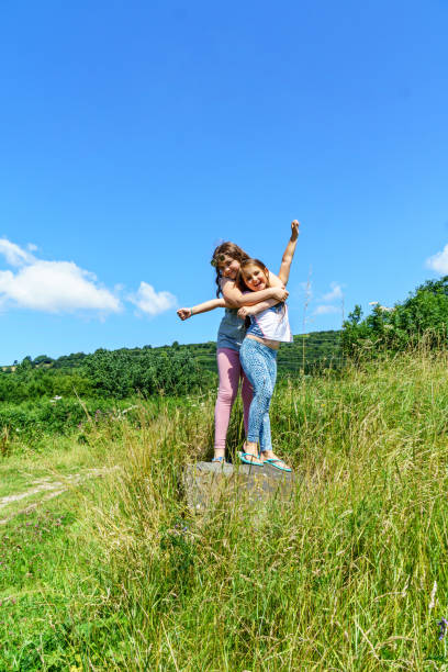 istock Two female cousins in countryside 903708056