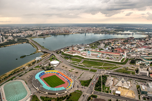 Helicopter point of view of Kazan, capital of Republic of Tatarstan, Russia. Many landmarks are visible in the image such as Kazan Kremlin, river Kazanka, Riviera Aquapark, Kazan Arena, Rubin Kazan...
