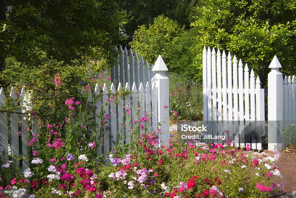 Beautiful Garden with open white gate White Picket Fence and Garden Gate Gate Stock Photo