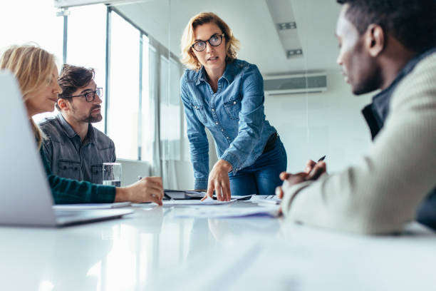 istock Businesswoman leading business presentation 903715608