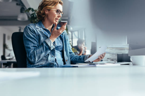 istock Businesswoman talking on smart phone with client 903717932