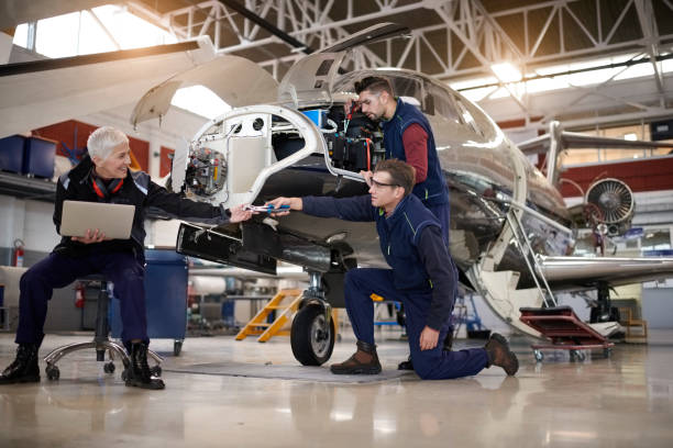 istock Aircraft mechanics in the hangar 903719508
