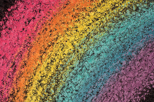 istock Closeup of Rainbow Chalk Arc Drawn Diagonally on Asphalt Surface 90371999