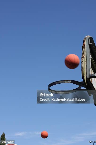 Two Basketballs In Midair Canada Stock Photo - Download Image Now - Basketball - Ball, Basketball Hoop, Clear Sky