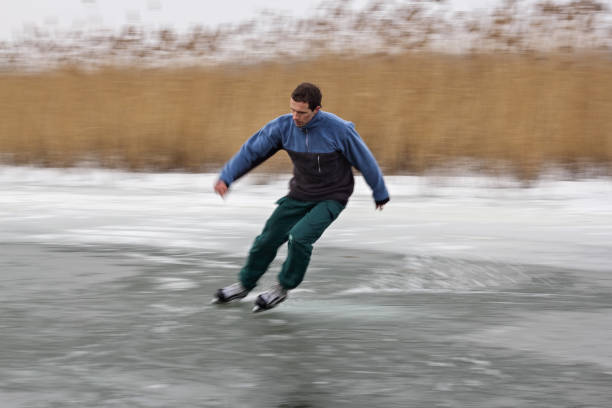 istock Man skating on frozen river 903723282