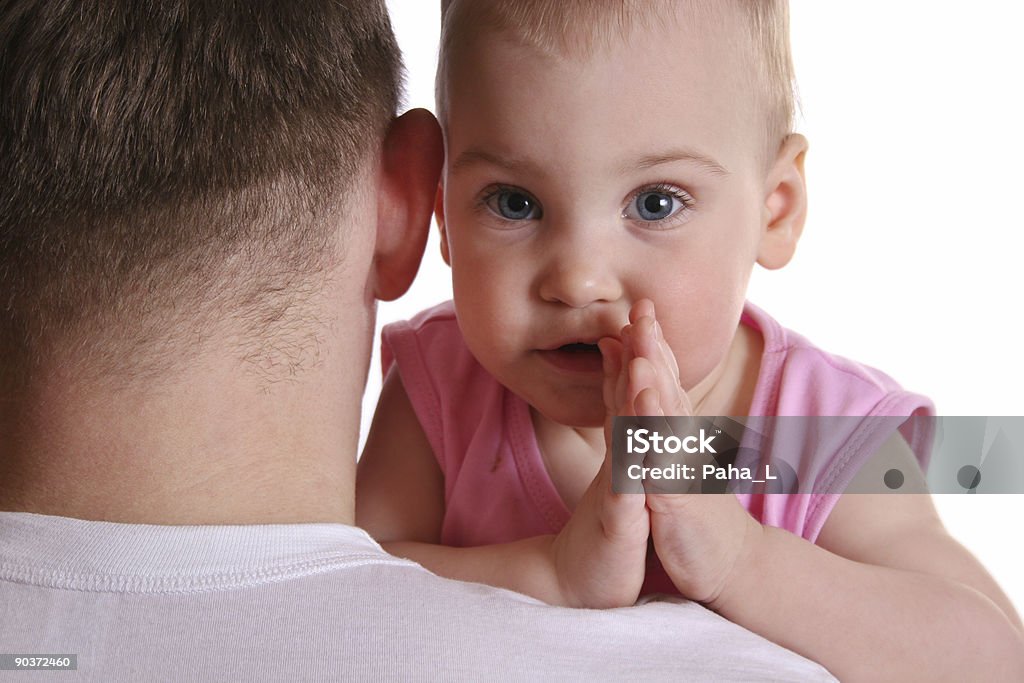 baby on father's shoulder  Adult Stock Photo