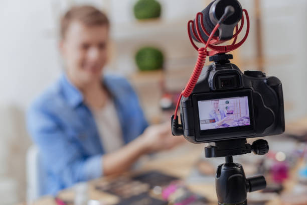 istock Modern camera recording a famous blogger in his room 903730446