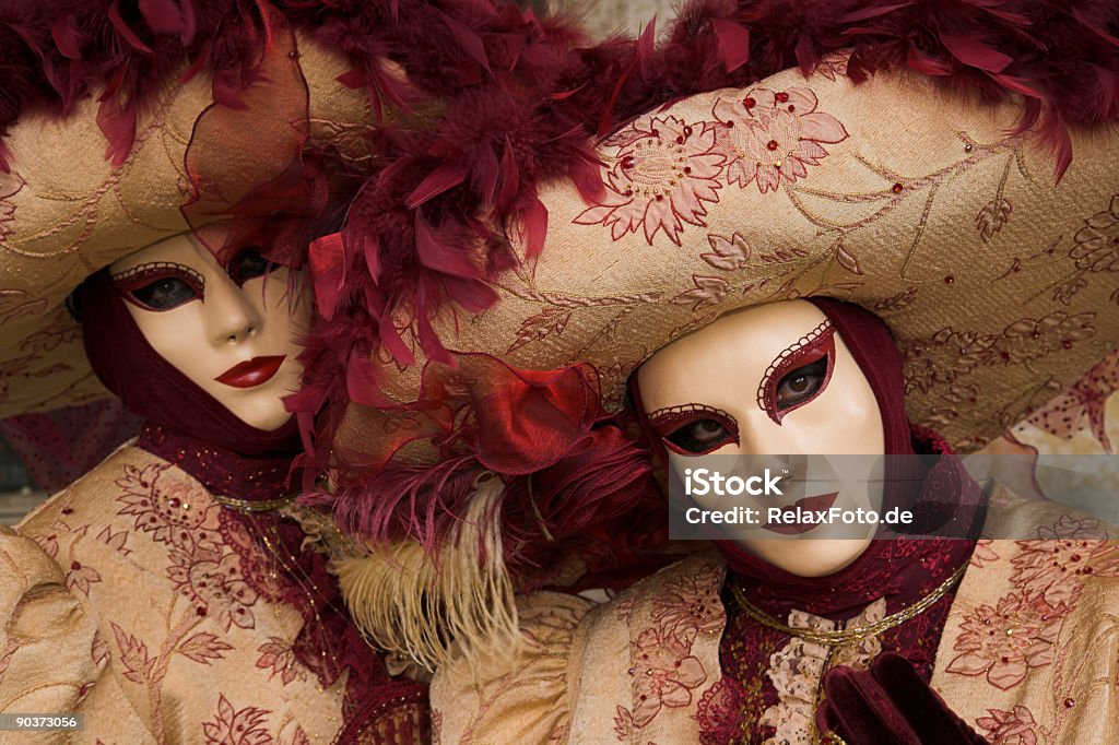 Two female masks with beautiful costumes at carnival in Venice  Mardi Gras Stock Photo