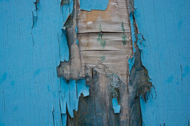istock Blue cracked painting on wooden surface 903730852