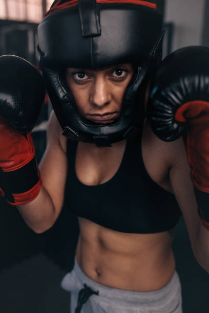 istock Female boxer geared up for a bout 903736332