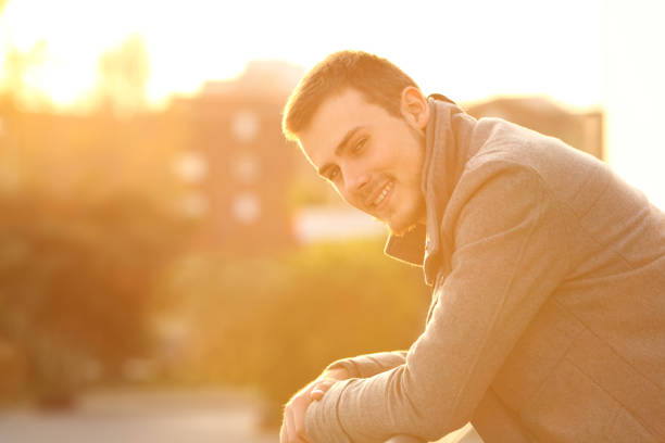 istock Happy man looking at you in a balcony in winter 903737526