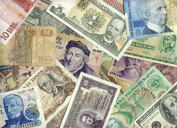 International currencies in a pile of paper money International currencies.  Bills from USA, Canada, Europe, Argentina, Uruguay, Israel, Peru, Mexico, Cuba, Egypt, Philippines and others. philippines currency stock pictures, royalty-free photos & images