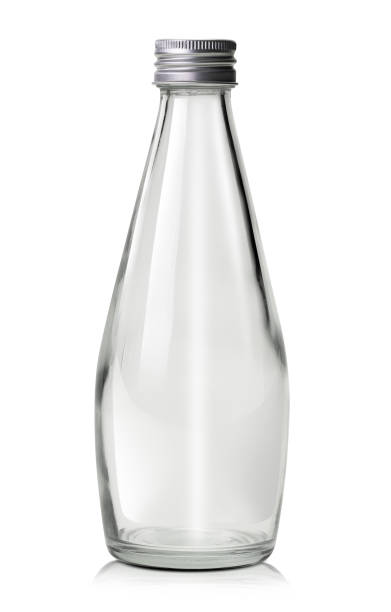 Glass water bottle isolated Empty glass water or milk bottle isolated on white background with clipping path soda bottle stock pictures, royalty-free photos & images