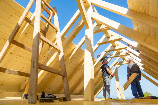 istock Builders at work with wooden roof construction. 903744312