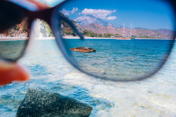 istock looking through glasses sky and sea 903744684