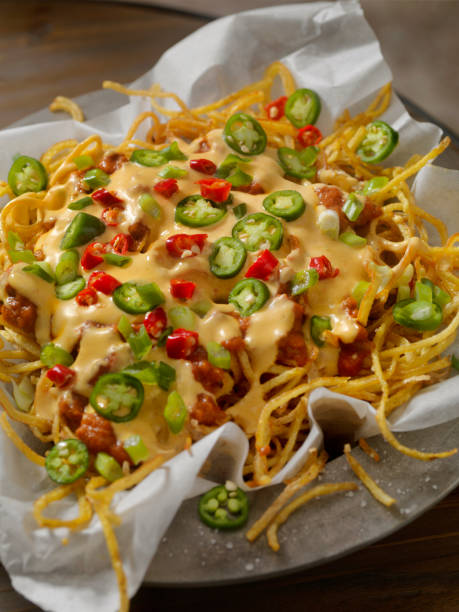 istock Nacho Style Thin and Crispy Spiral Fries with Chili and Cheese Sauce 903747890