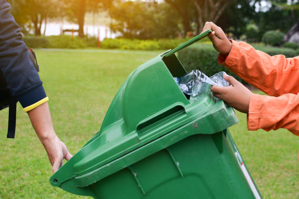 istock Cropped Hands Of People Cleaning Park 903751858