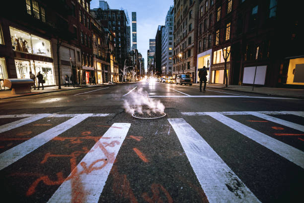 Traffic in New York city at night Traffic in New York city at night manhole stock pictures, royalty-free photos & images