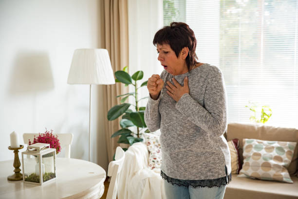 Sick mature woman with sore throat