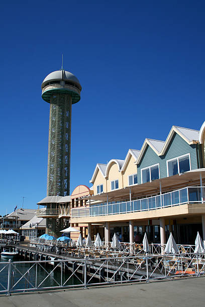 Tower and buildings at a wharf stock photo