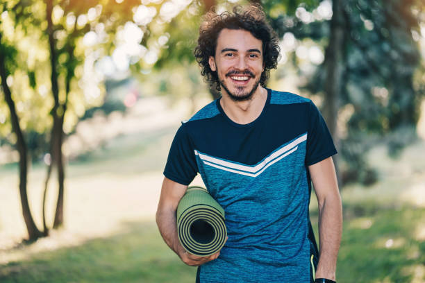 istock Young athlete with yoga mat 903762772