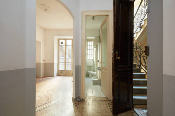 istock Empty, old apartment interior with bathroom, living room and staircase view 903764778