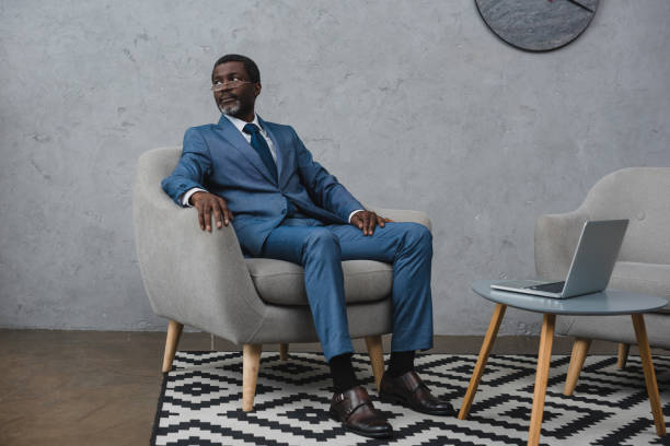 istock businessman sitting in armchair 903765454