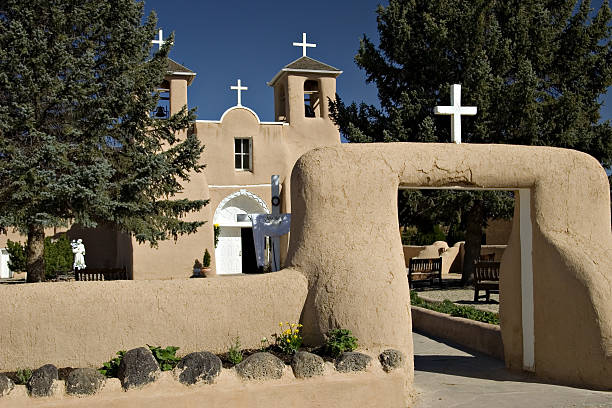 istock Adobe Catholic Church With White Crosses - Taos, New Mexico 90376852