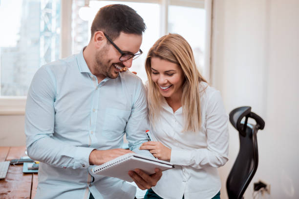 istock Laughing business partners discussing documents at the meeting. 903771232