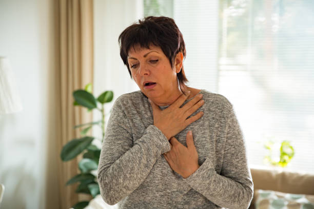 istock Sick mature woman with sore throat 903771778